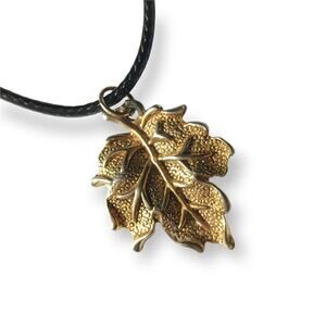 Golden leaf pendant necklace, waxed black cotton cord (gold tone)